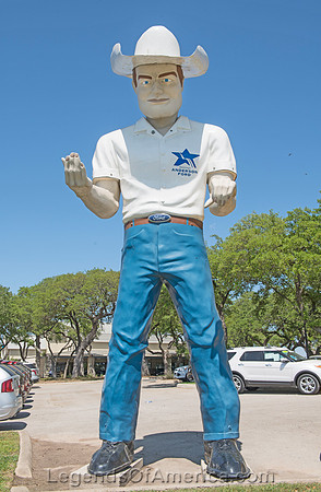 Boerne, TX - Large Cowboy Statue at Car Dealership.
