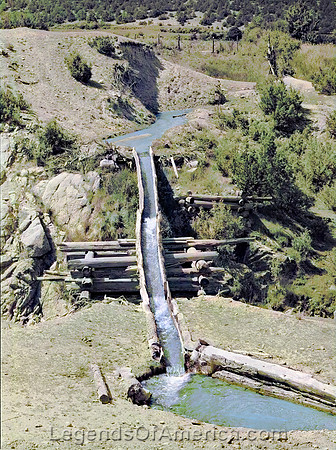 Las Trampas, NM - Transporting irrigation waters across ditch, 1940