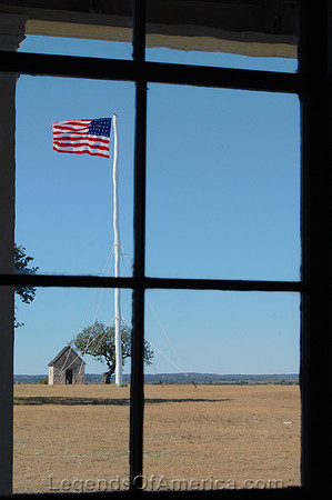 Fort McKavett, TX - Flag Through Window