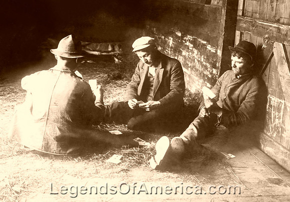 Tramps in a boxcar playing cards